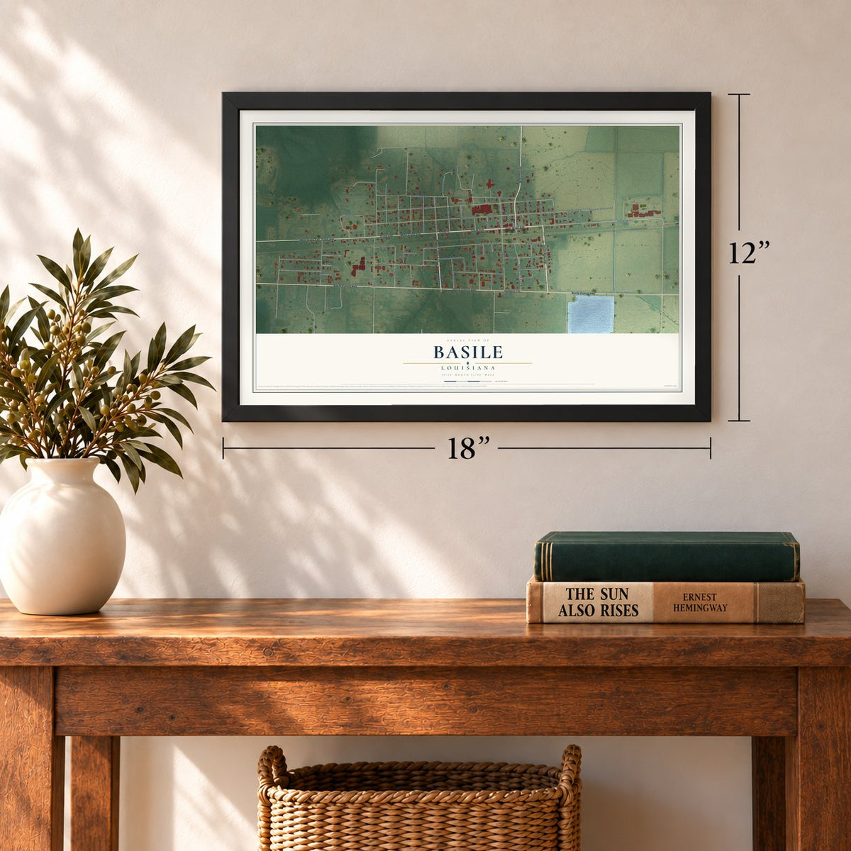 Basile, Louisiana map, 12 x 18 inch print in a black frame in an entryway