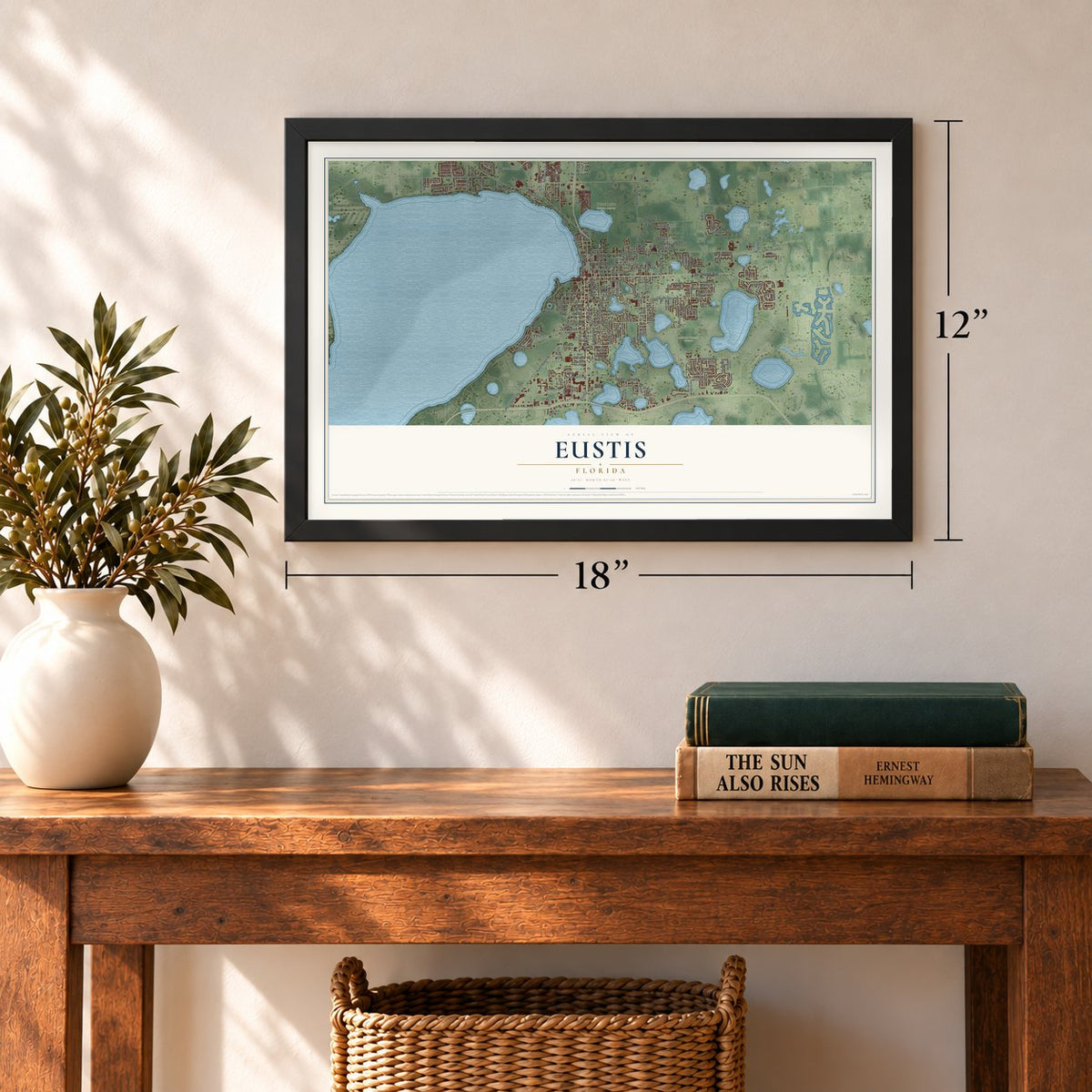 Eustis, Florida map, 12 x 18 inch print in a black frame in an entryway