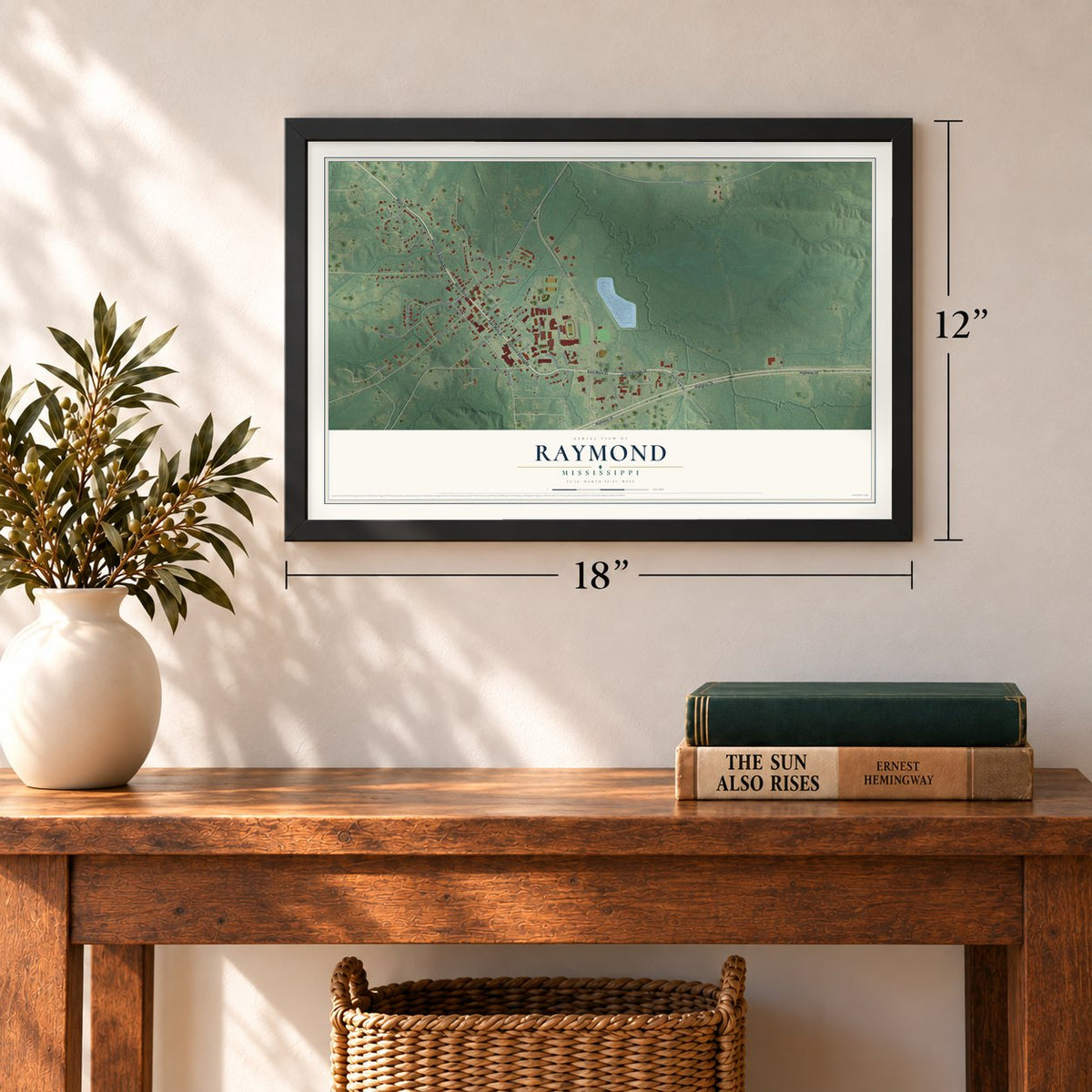 Raymond, Mississippi map, 12 x 18 inch print in a black frame in an entryway