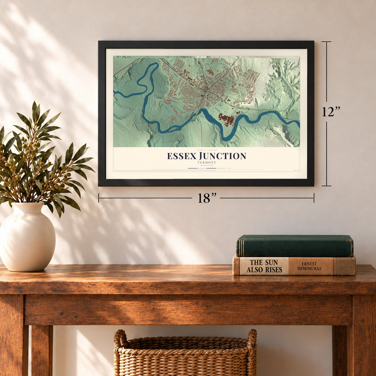 Essex Junction, Vermont map, 12 x 18 inch print in a black frame in an entryway