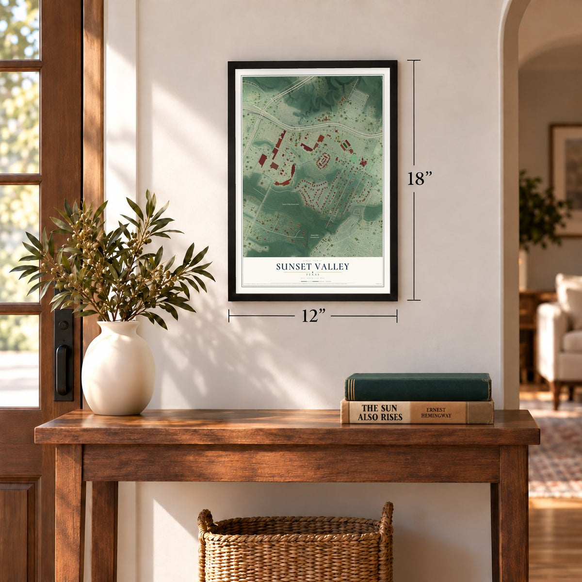 Sunset Valley, Texas map, 12 x 18 inch print in a black frame in an entryway