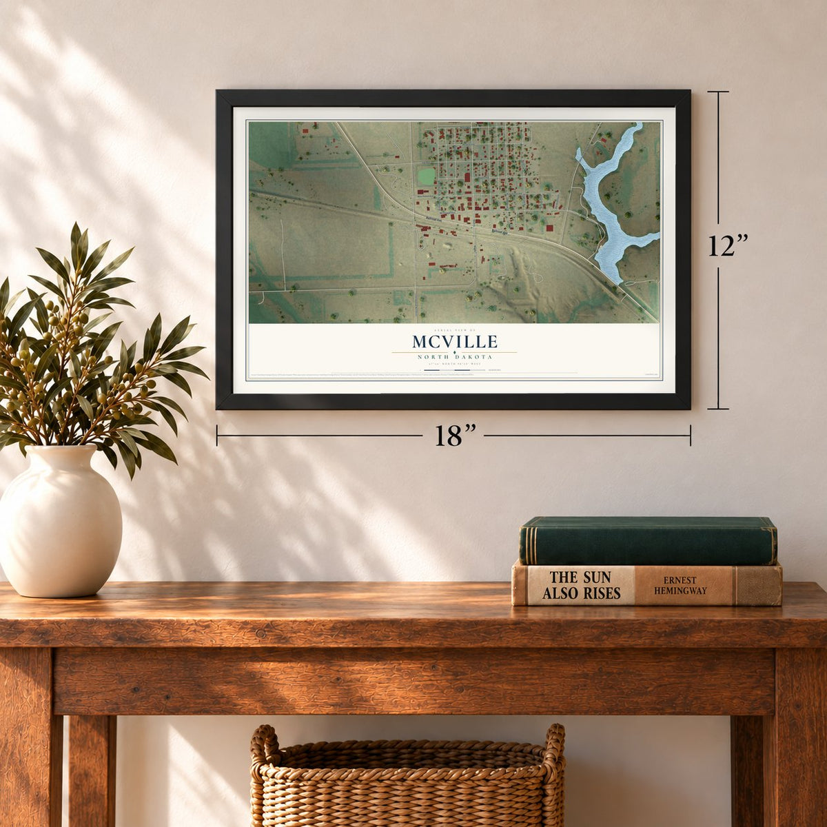 McVille, North Dakota map, 12 x 18 inch print in a black frame in an entryway