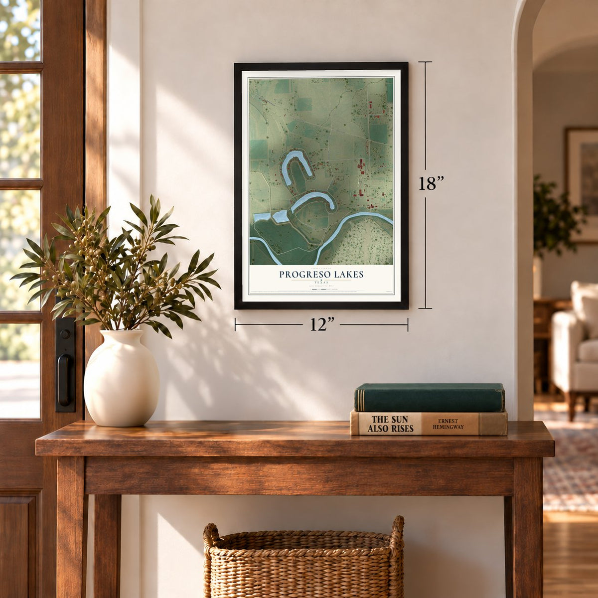 Progreso Lakes, Texas map, 12 x 18 inch print in a black frame in an entryway