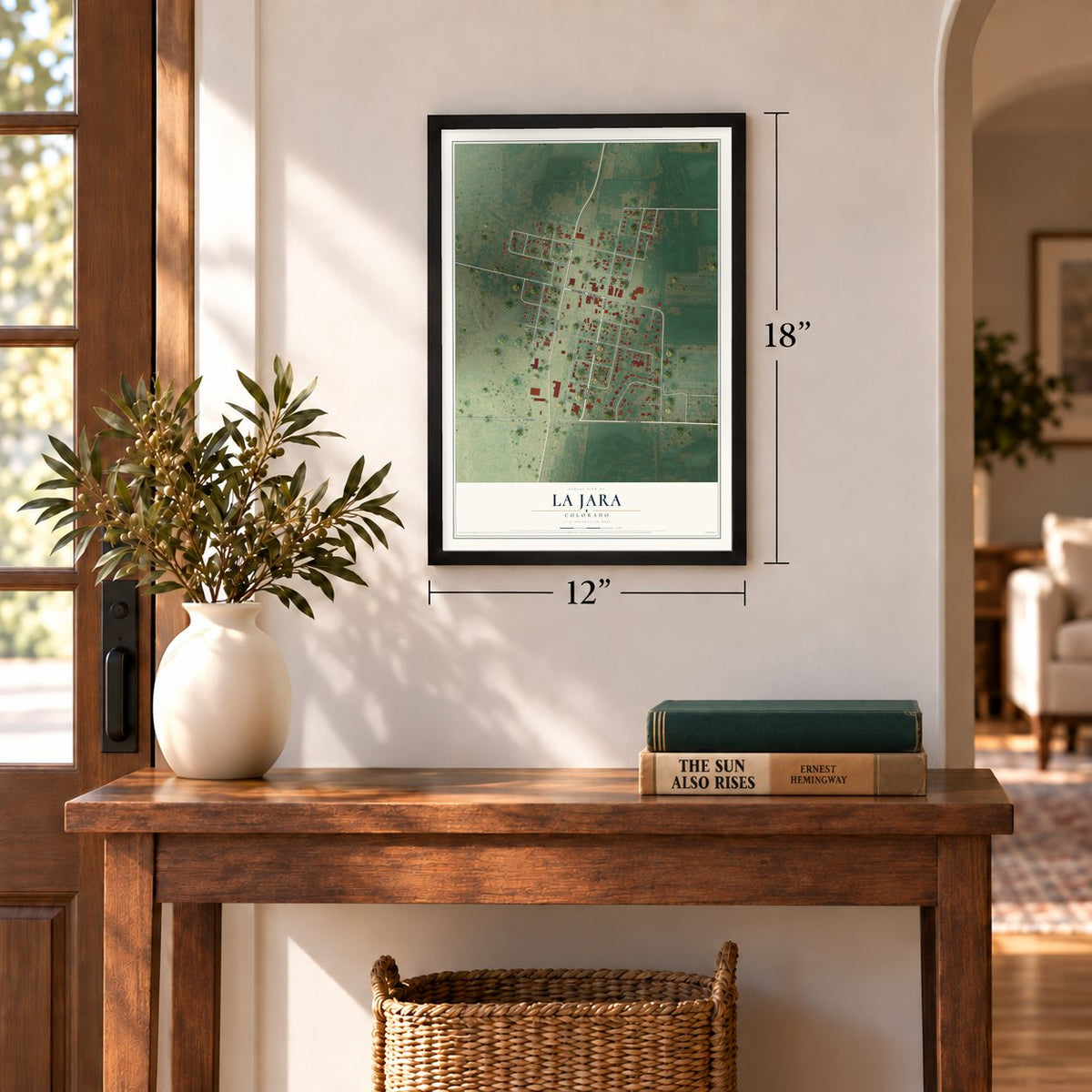 La Jara, Colorado map, 12 x 18 inch print in a black frame in an entryway