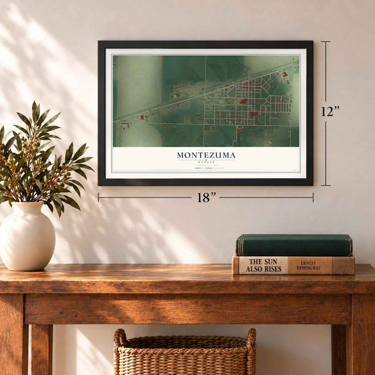Montezuma, Kansas map, 12 x 18 inch print in a black frame in an entryway
