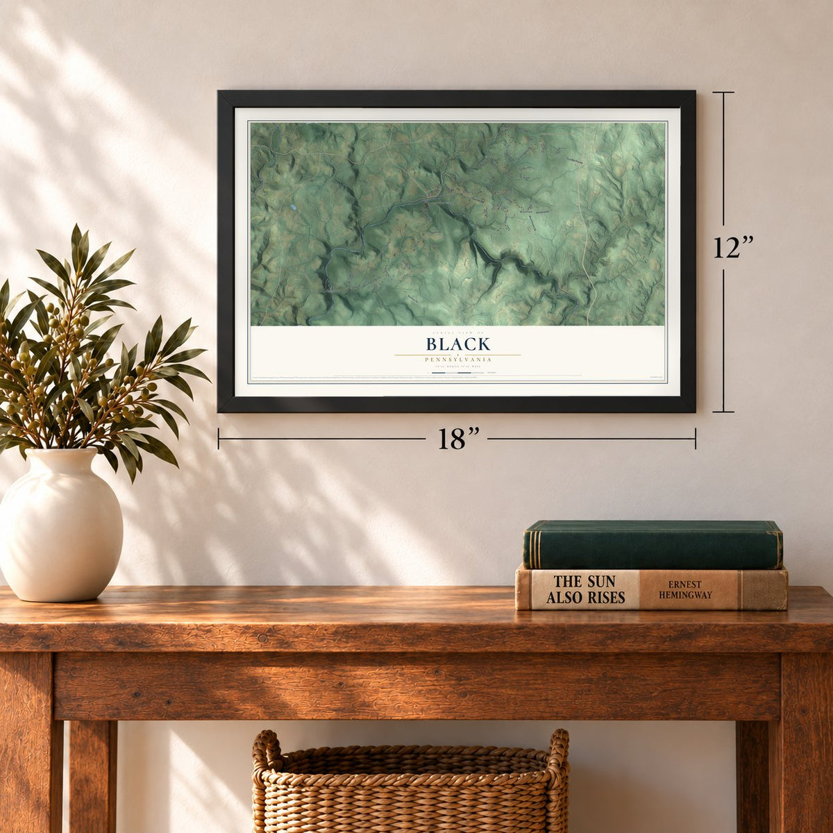 Black, Pennsylvania map, 12 x 18 inch print in a black frame in an entryway