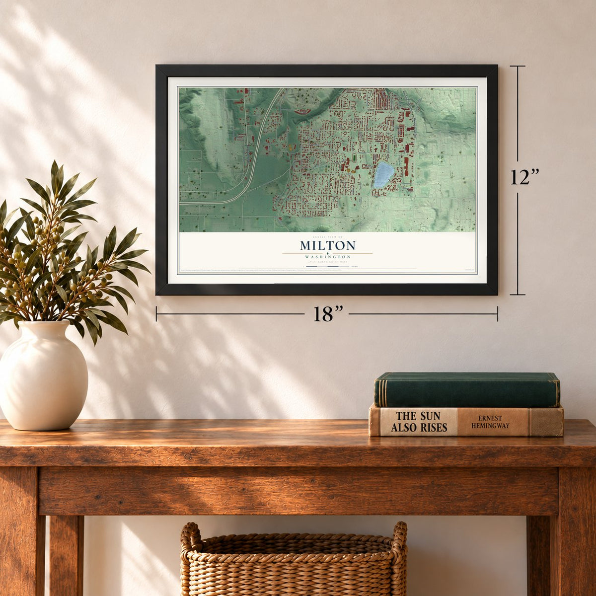 Milton, Washington map, 12 x 18 inch print in a black frame in an entryway