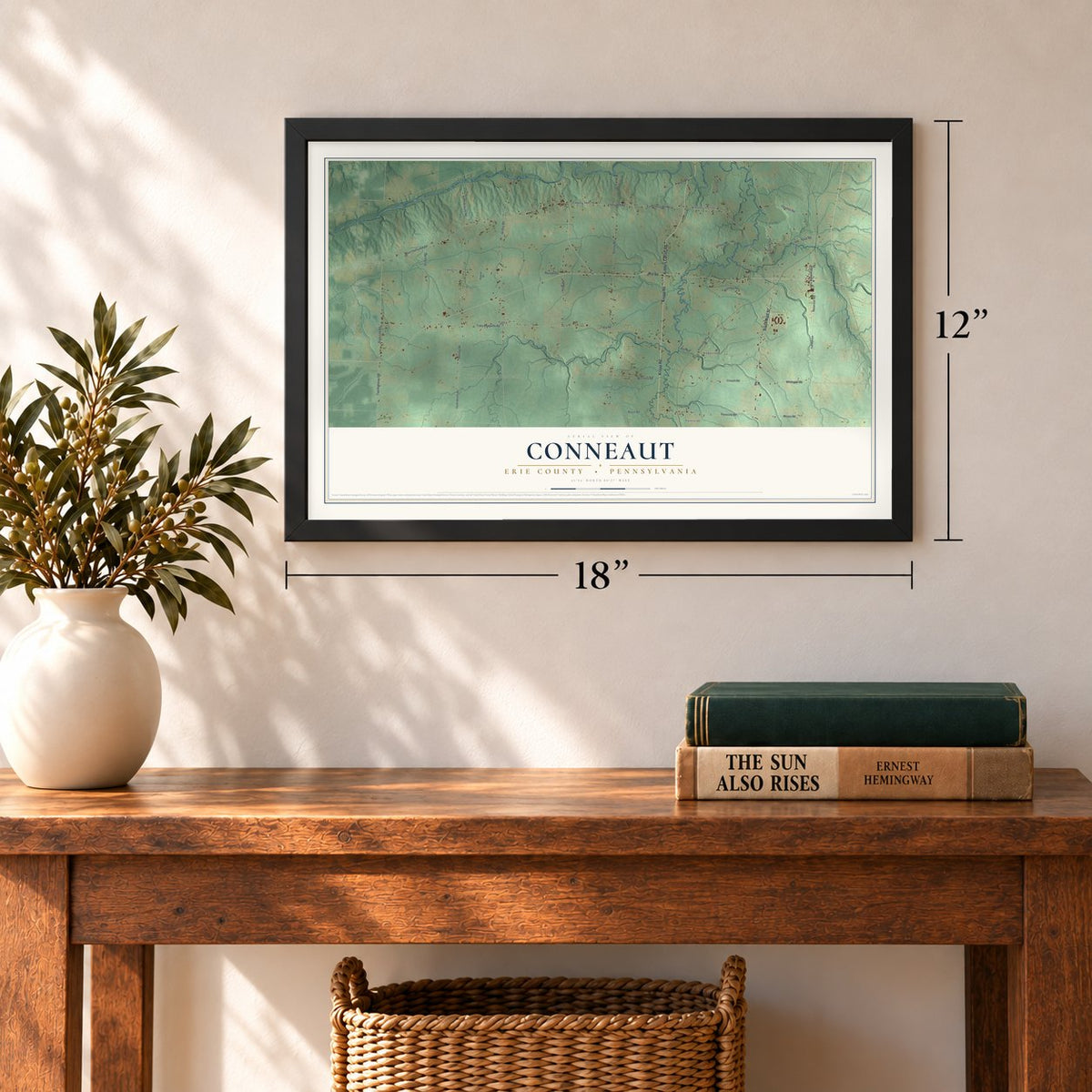 Conneaut, Erie County, Pennsylvania map, 12 x 18 inch print in a black frame in an entryway