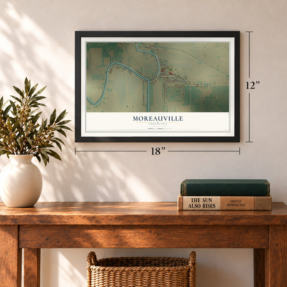 Moreauville, Louisiana map, 12 x 18 inch print in a black frame in an entryway
