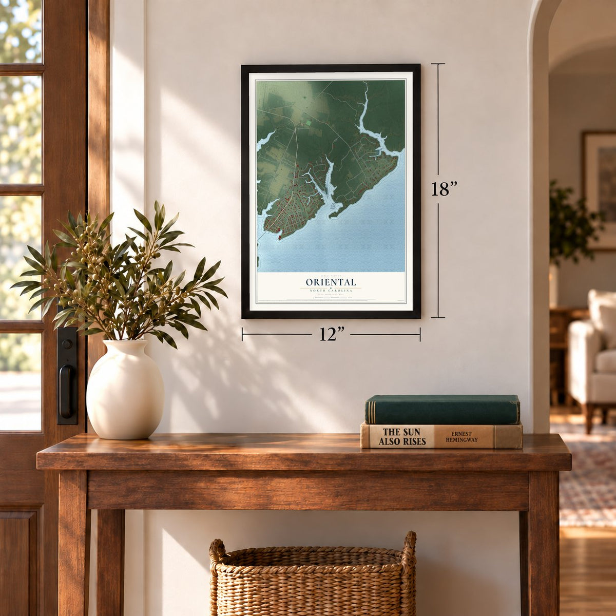 Oriental, North Carolina map, 12 x 18 inch print in a black frame in an entryway
