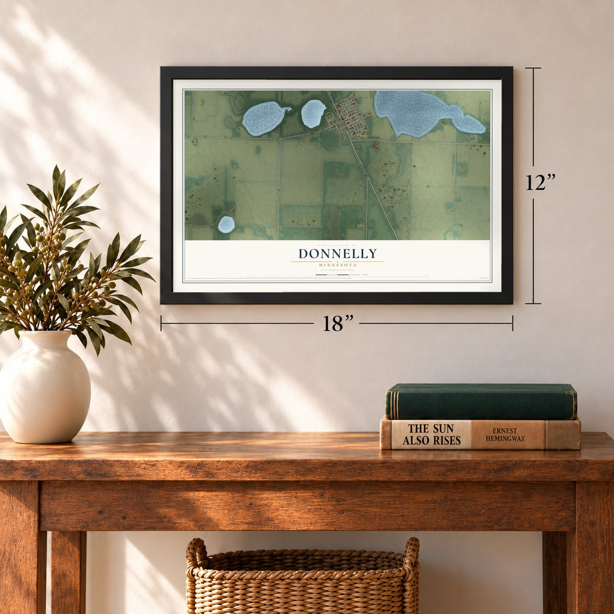 Donnelly, Minnesota map, 12 x 18 inch print in a black frame in an entryway