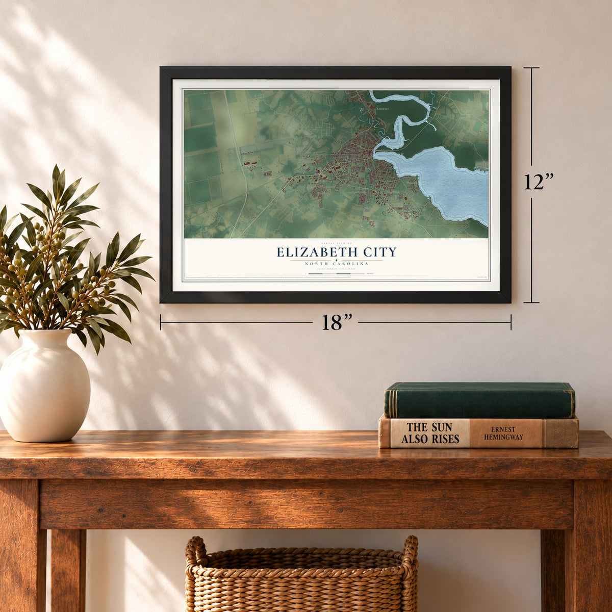 Elizabeth City, North Carolina map, 12 x 18 inch print in a black frame in an entryway