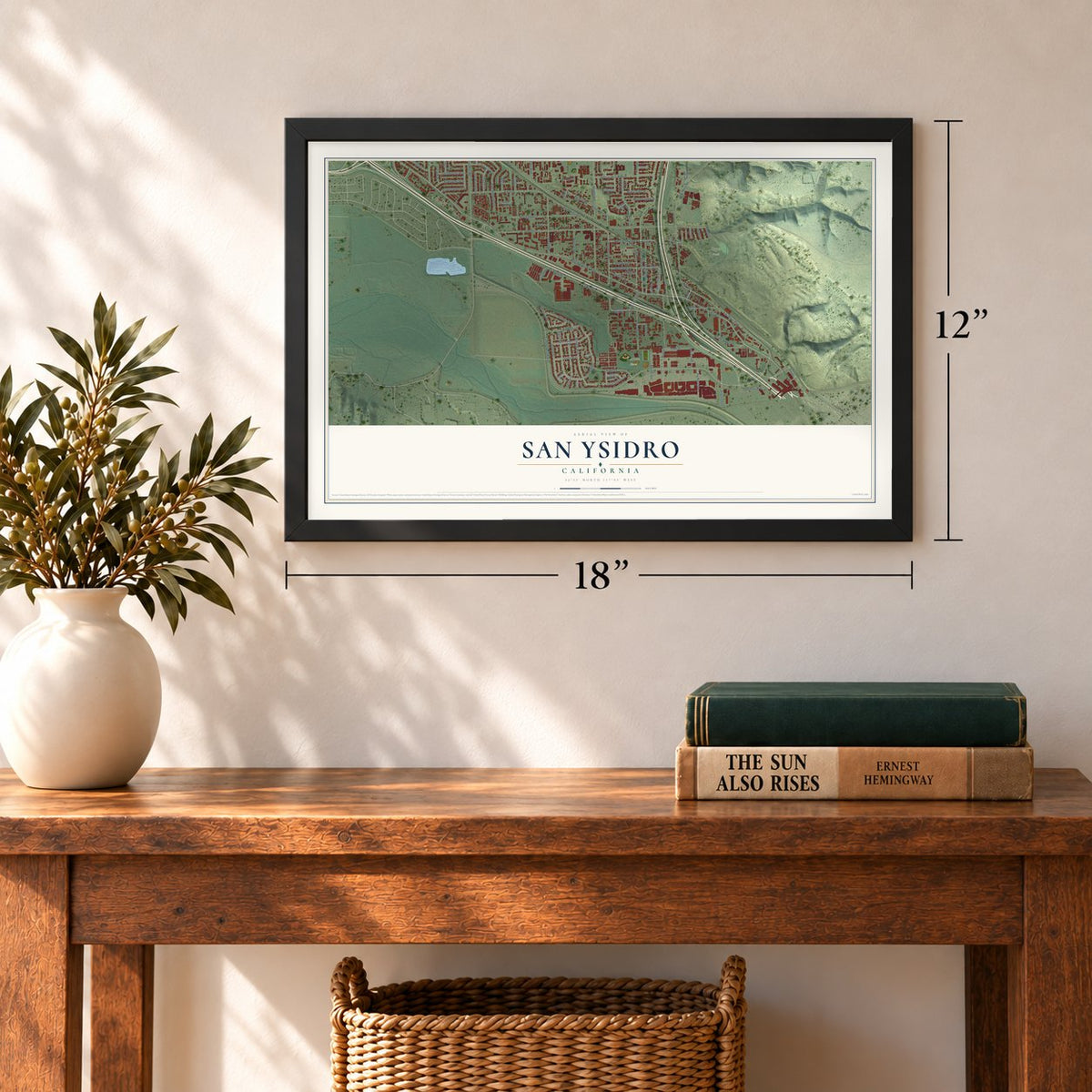 San Ysidro, California map, 12 x 18 inch print in a black frame in an entryway