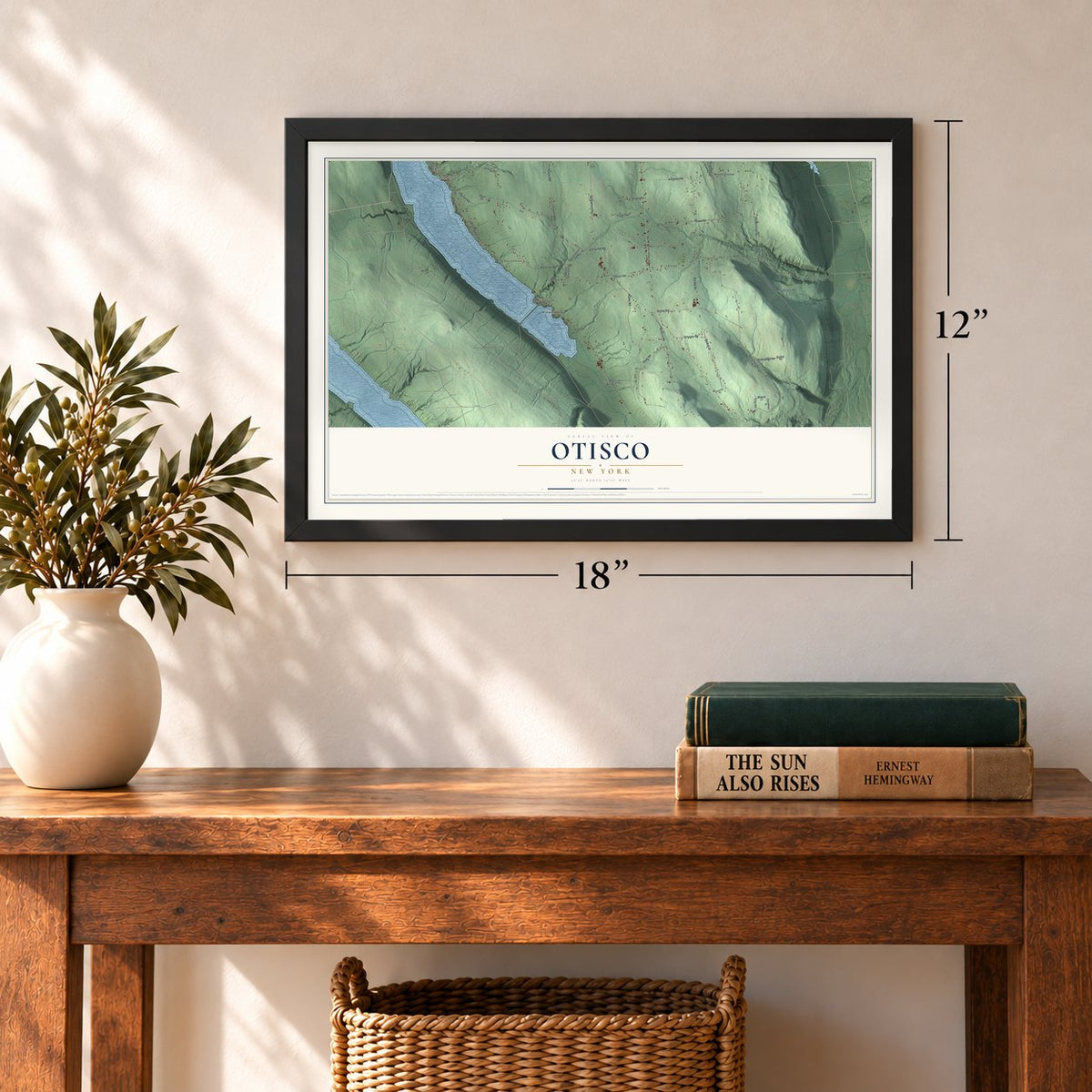 Otisco, New York map, 12 x 18 inch print in a black frame in an entryway