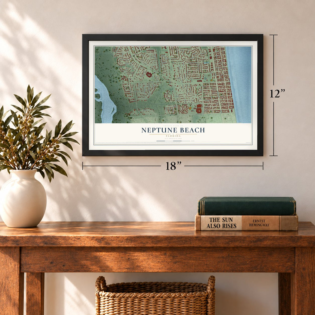 Neptune Beach, Florida map, 12 x 18 inch print in a black frame in an entryway