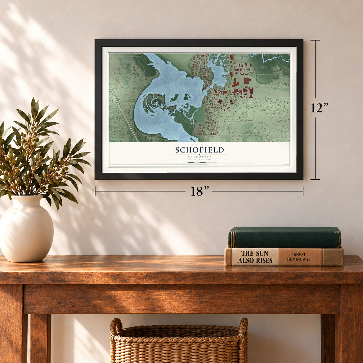 Schofield, Wisconsin map, 12 x 18 inch print in a black frame in an entryway