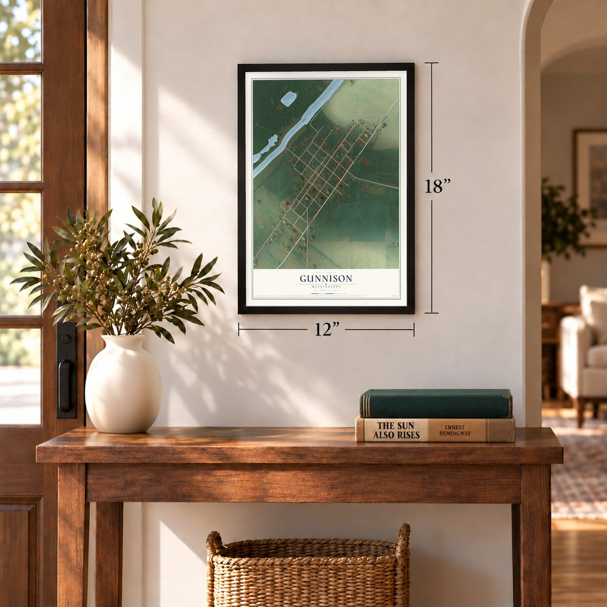 Gunnison, Mississippi map, 12 x 18 inch print in a black frame in an entryway
