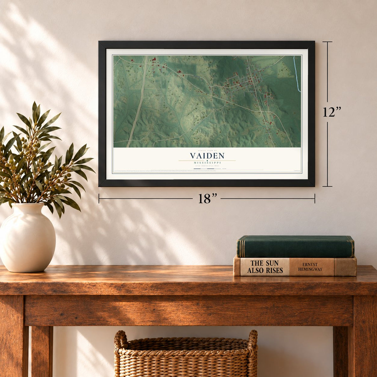Vaiden, Mississippi map, 12 x 18 inch print in a black frame in an entryway
