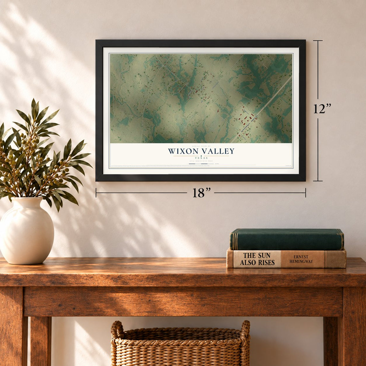 Wixon Valley, Texas map, 12 x 18 inch print in a black frame in an entryway