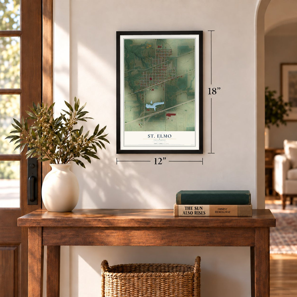 St. Elmo, Illinois map, 12 x 18 inch print in a black frame in an entryway