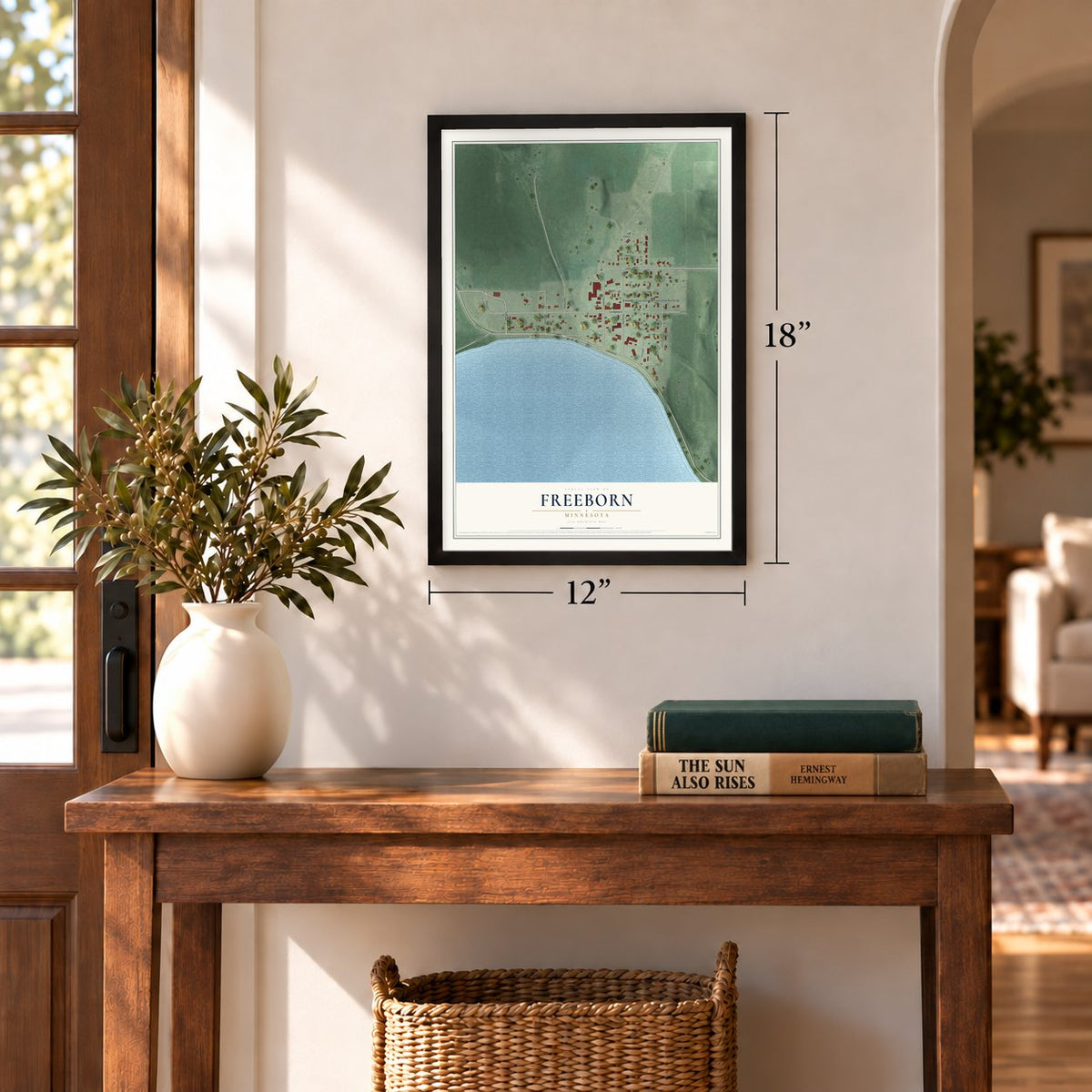 Freeborn, Minnesota map, 12 x 18 inch print in a black frame in an entryway