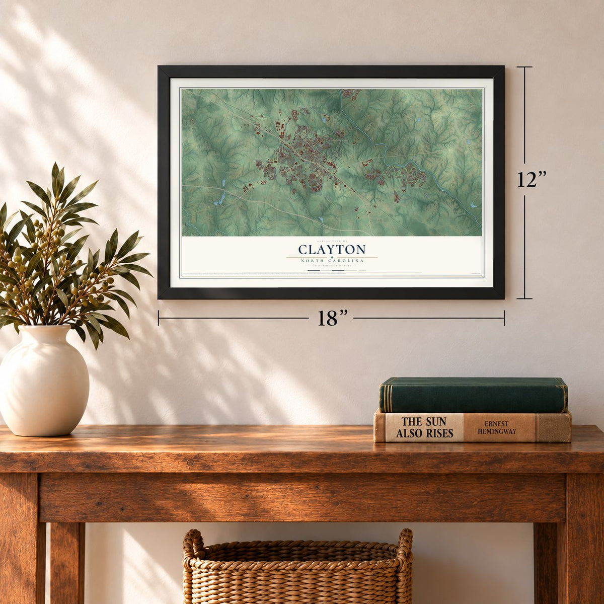 Clayton, North Carolina map, 12 x 18 inch print in a black frame in an entryway