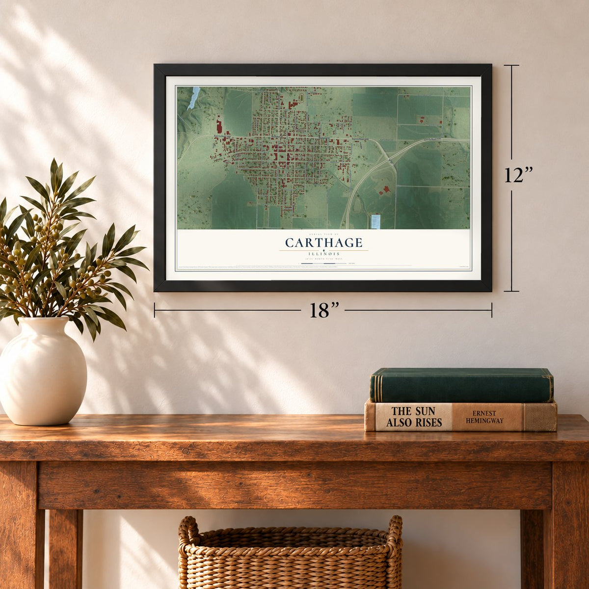 Carthage, Illinois map, 12 x 18 inch print in a black frame in an entryway