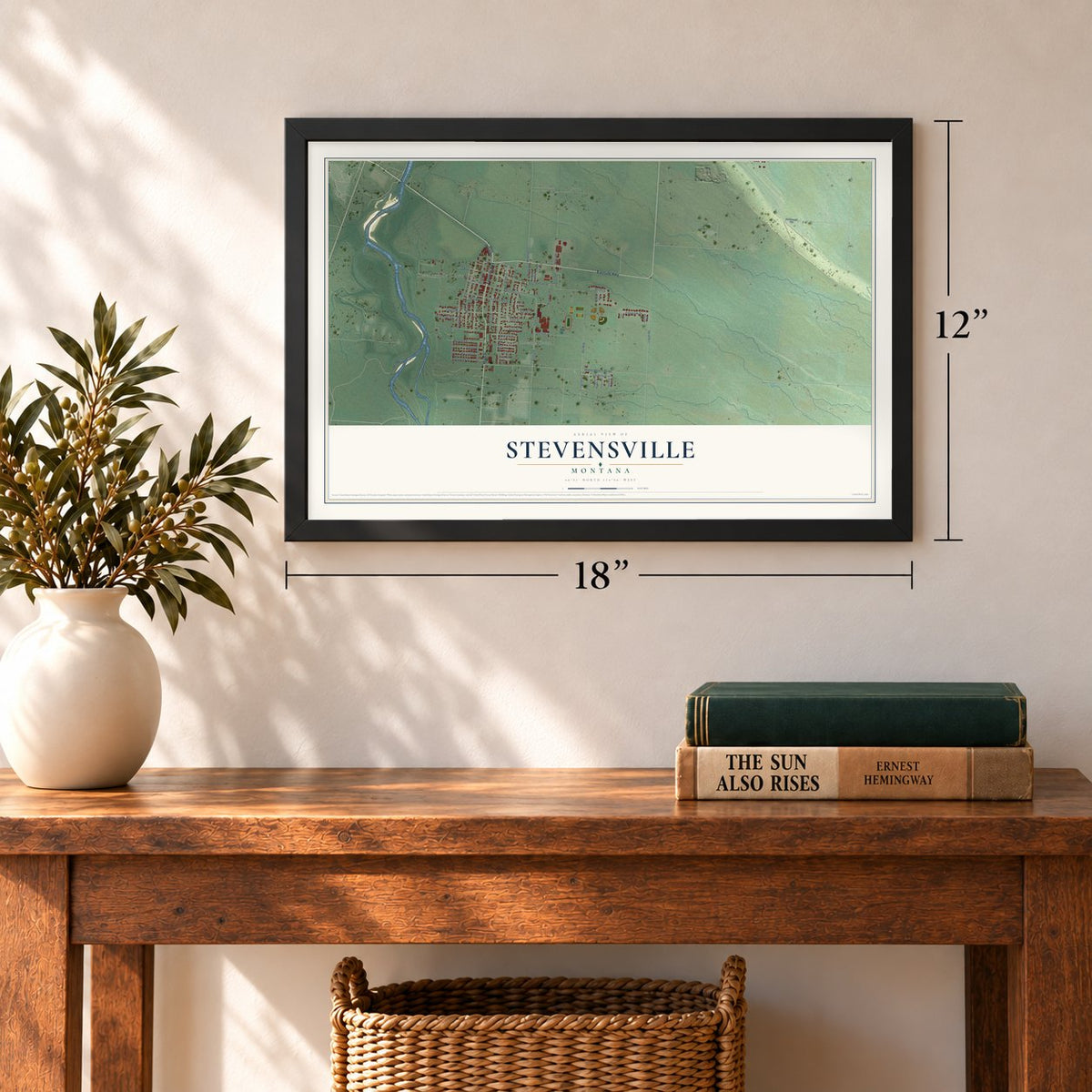 Stevensville, Montana map, 12 x 18 inch print in a black frame in an entryway