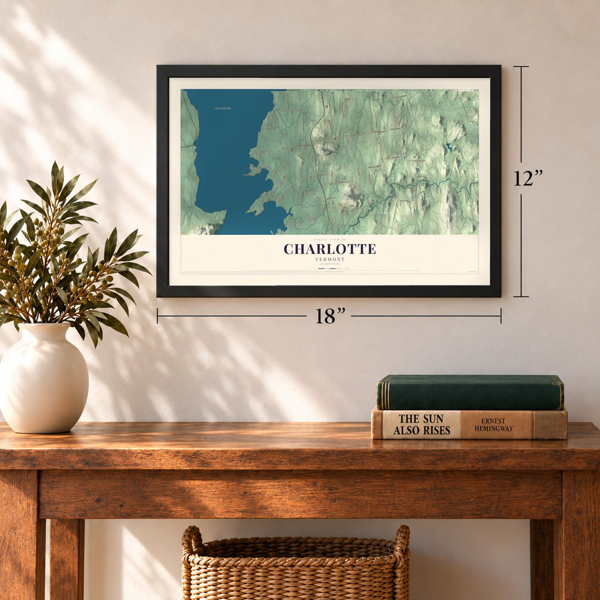Charlotte, Vermont map, 12 x 18 inch print in a black frame in an entryway