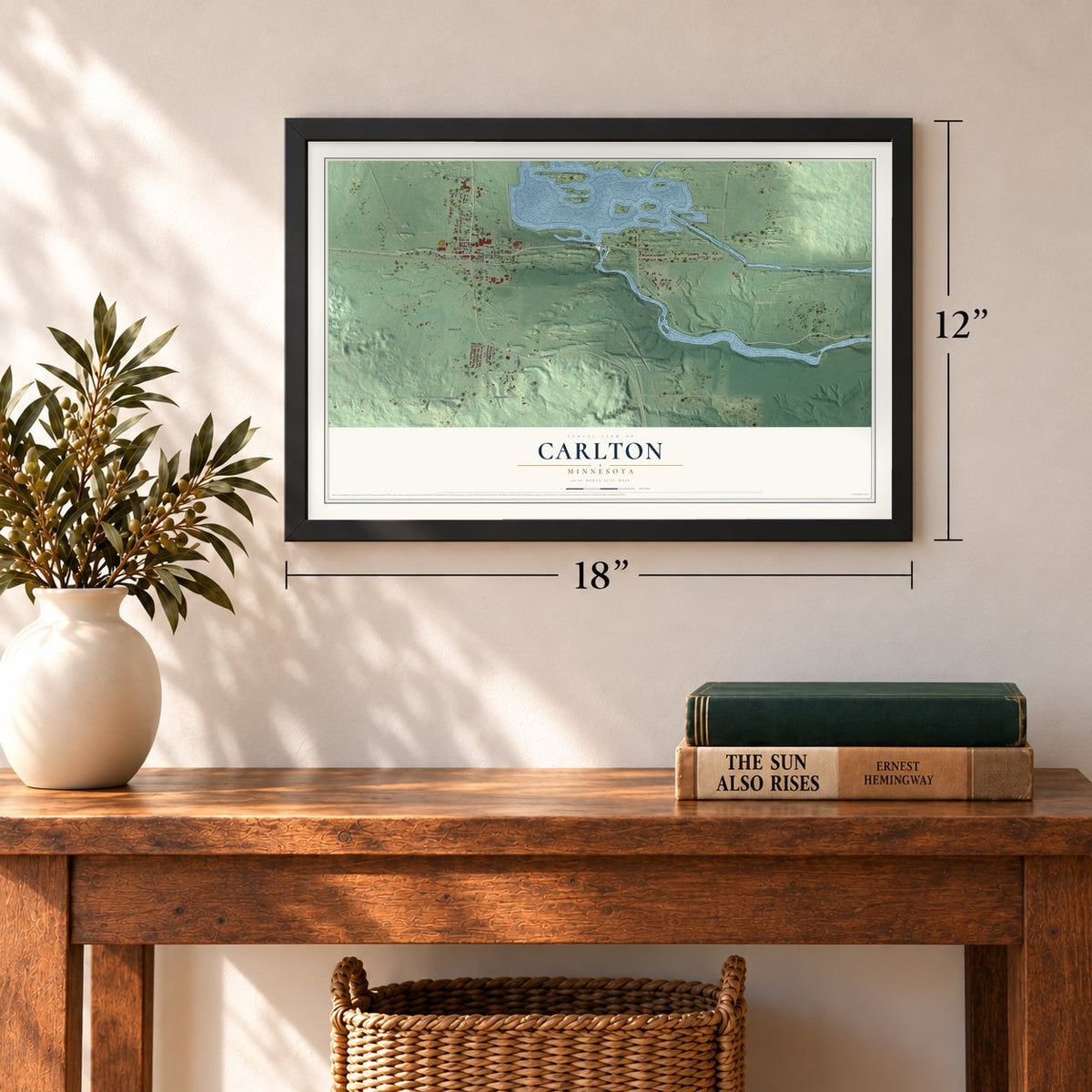 Carlton, Minnesota map, 12 x 18 inch print in a black frame in an entryway