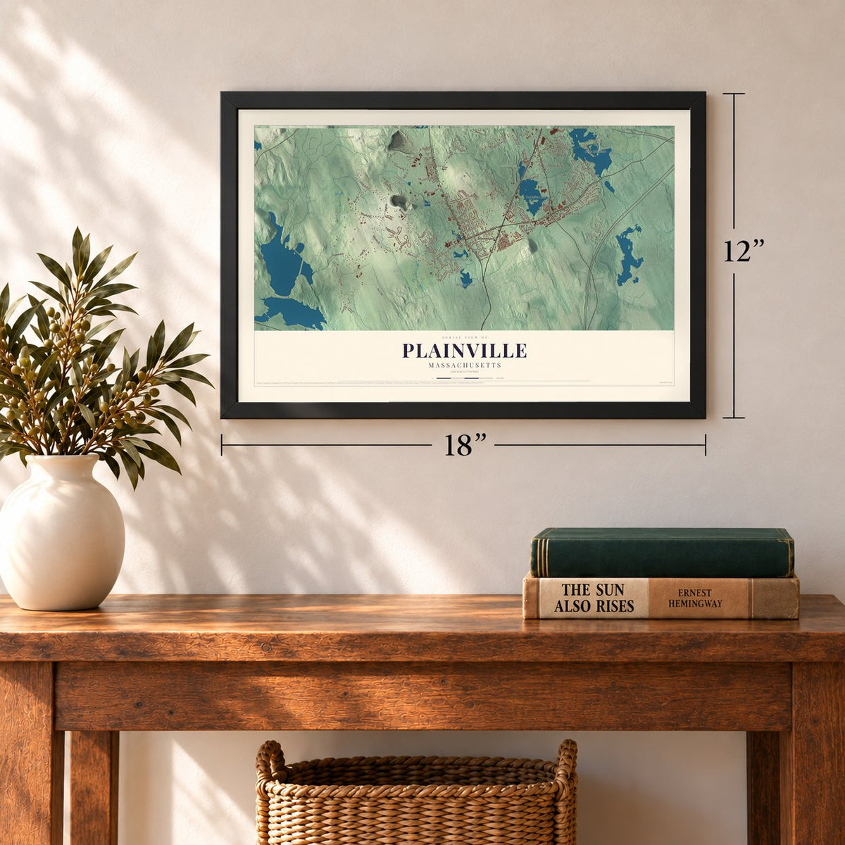 Plainville, Massachusetts map, 12 x 18 inch print in a black frame in an entryway