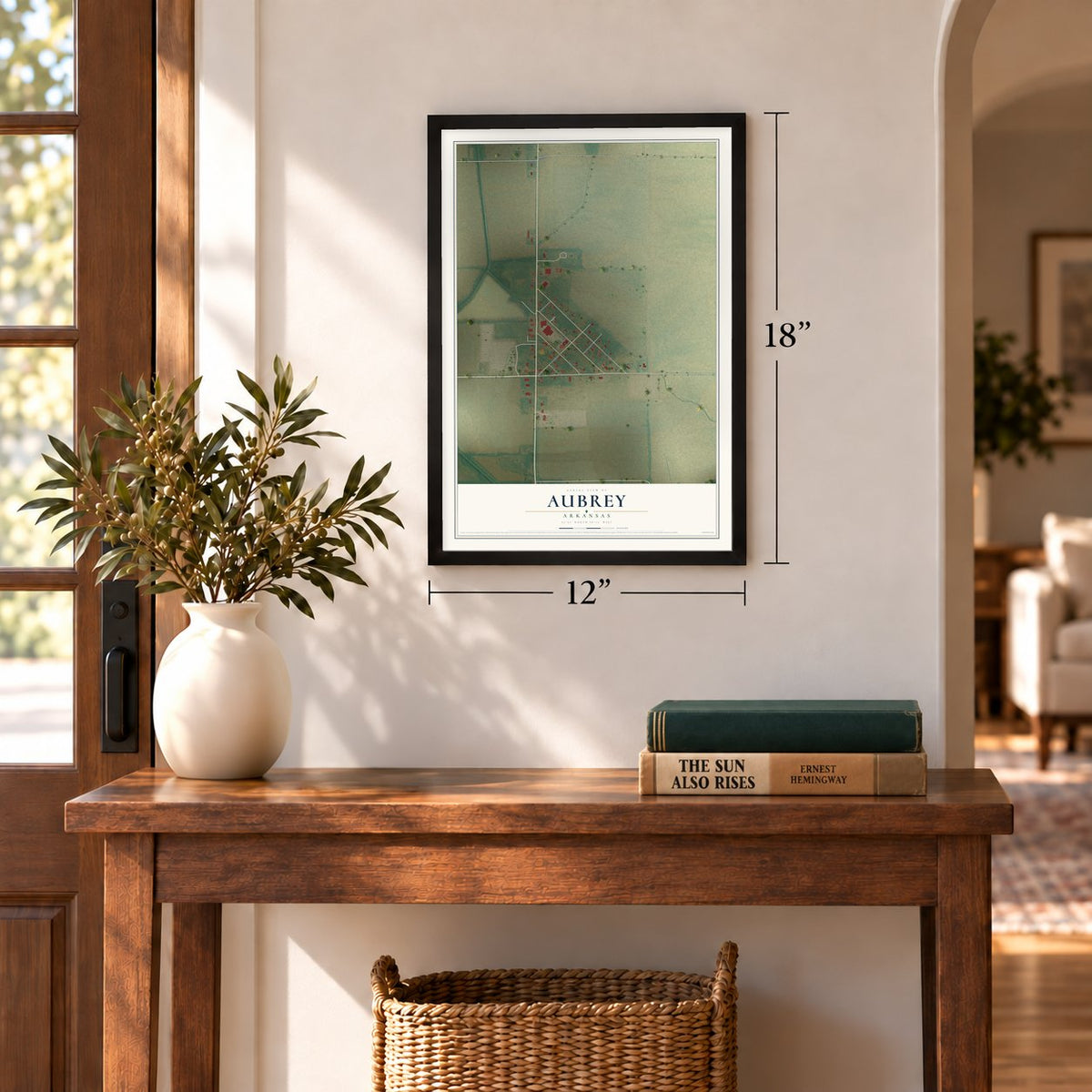 Aubrey, Arkansas map, 12 x 18 inch print in a black frame in an entryway