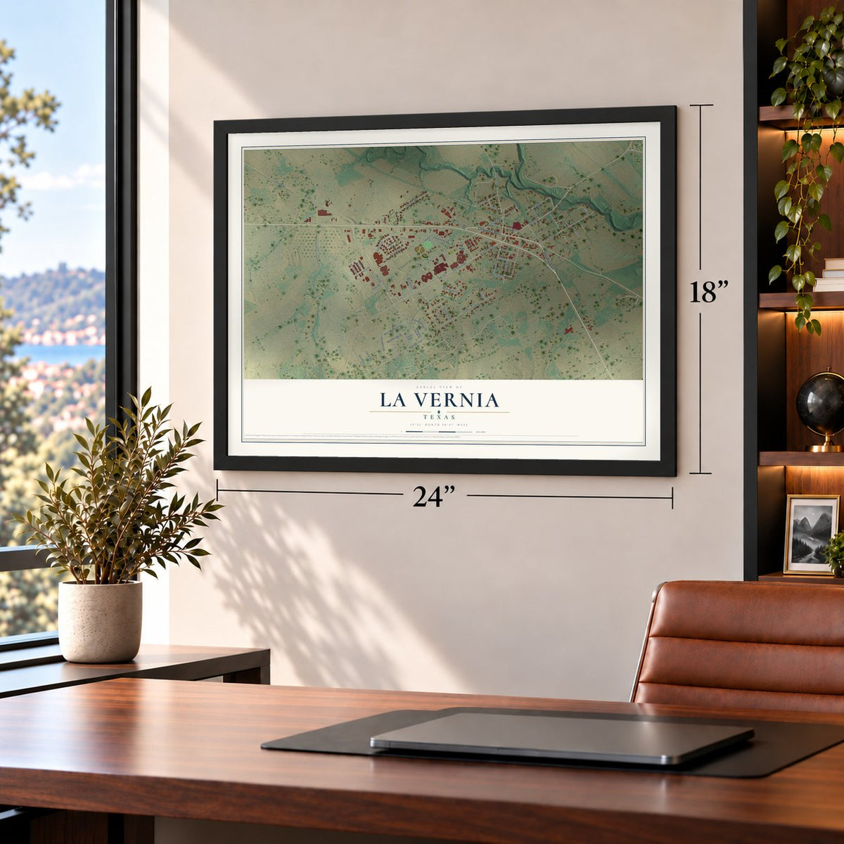 La Vernia, Texas map, 18 x 24 inch print in a black frame in a home office