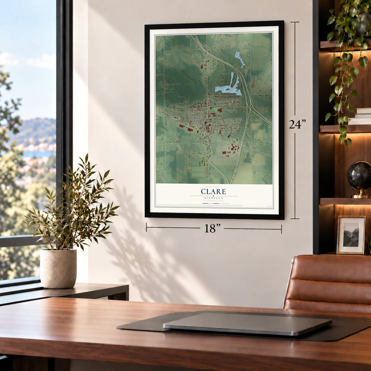 Clare, Michigan map, 18 x 24 inch print in a black frame in a home office