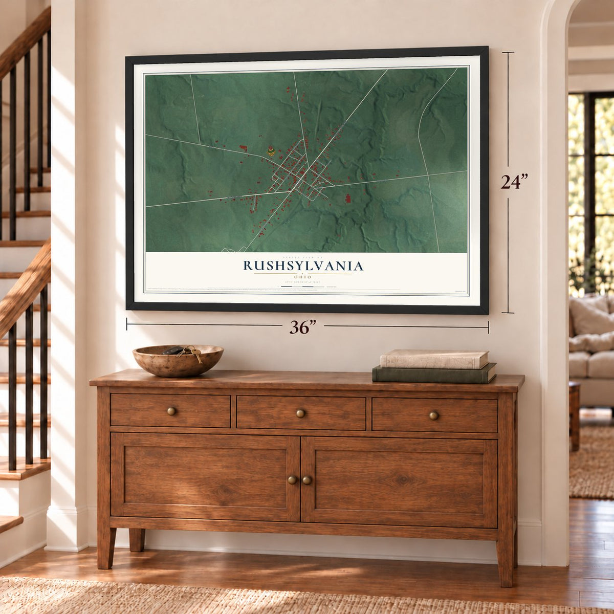Rushsylvania, Ohio map, 24 x 36 inch print in a black frame above a dresser by a staircase