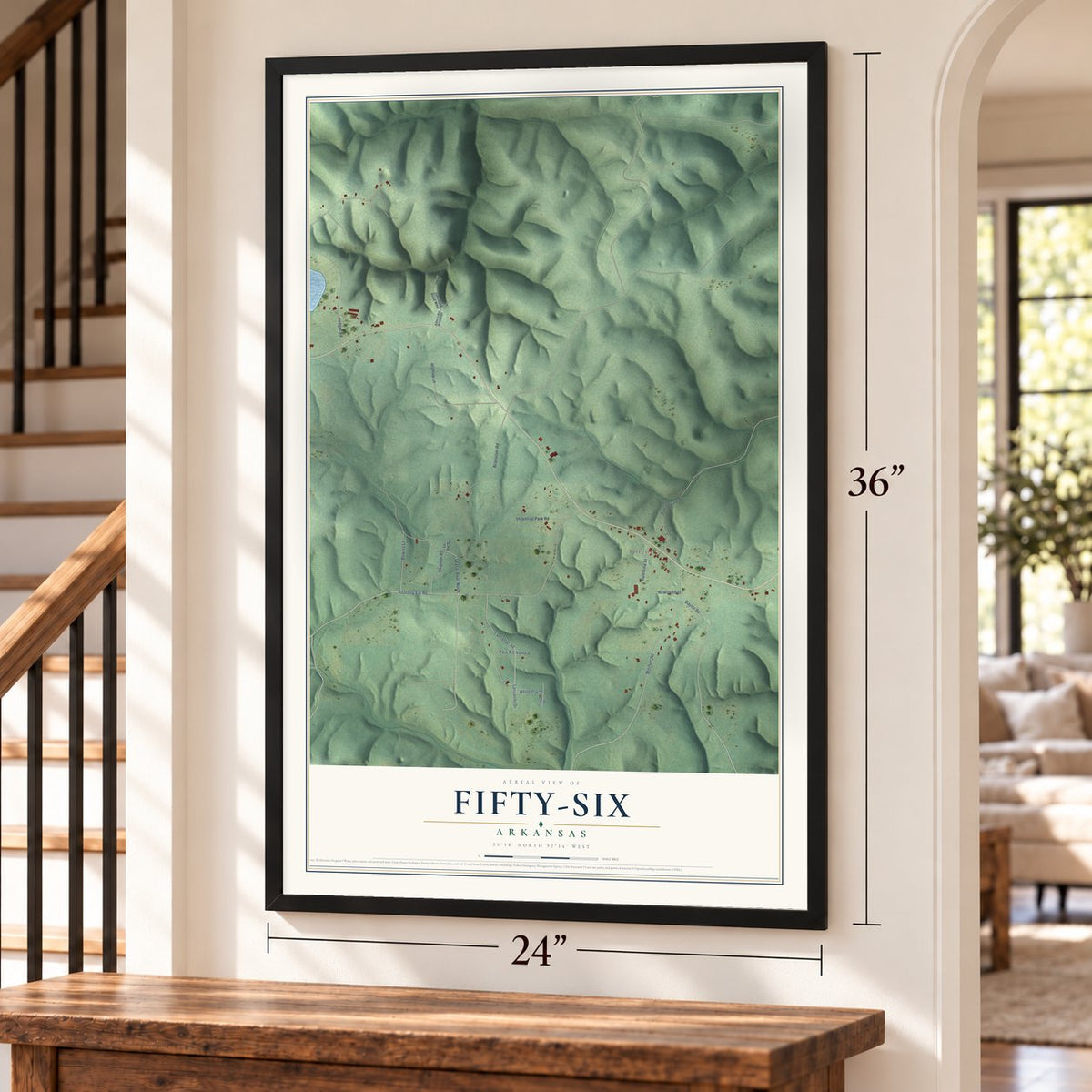 Fifty-Six, Arkansas map, 24 x 36 inch print in a black frame by a staircase
