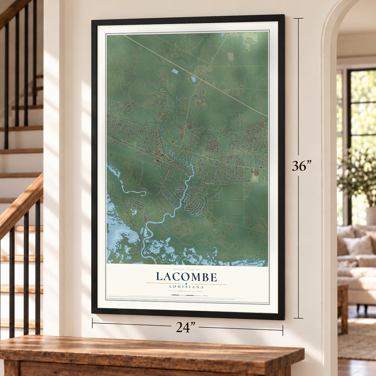 Lacombe, Louisiana map, 24 x 36 inch print in a black frame by a staircase