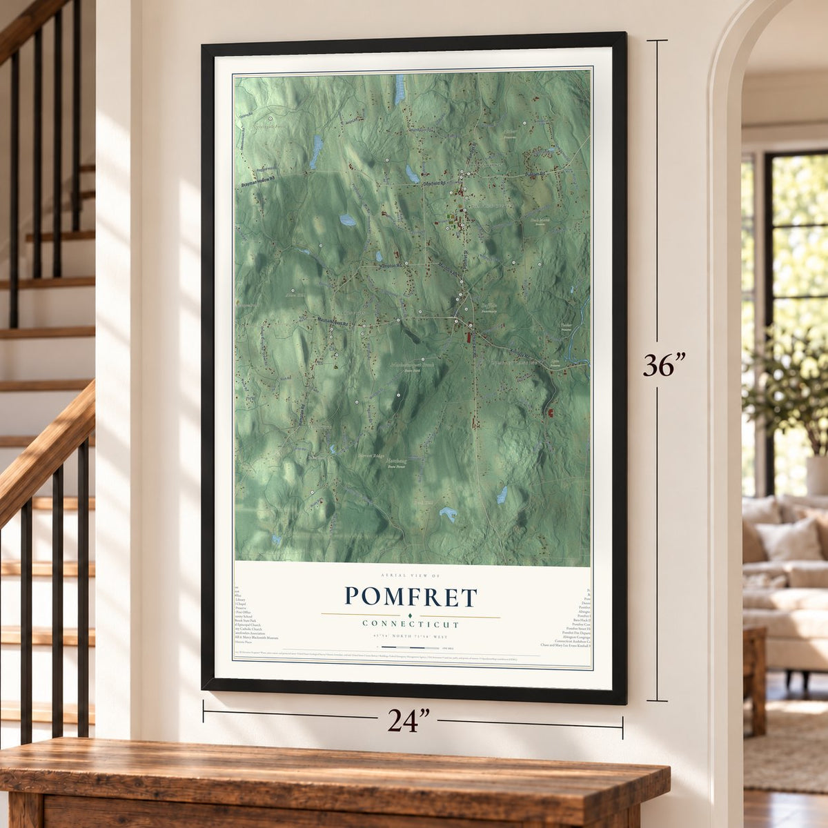Pomfret, Connecticut map, 24 x 36 inch print in a black frame by a staircase