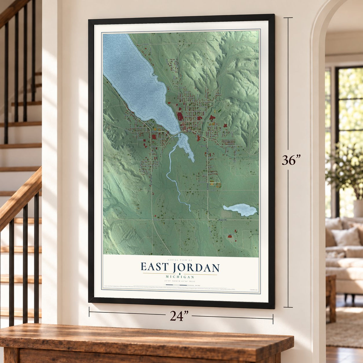 East Jordan, Michigan map, 24 x 36 inch print in a black frame by a staircase