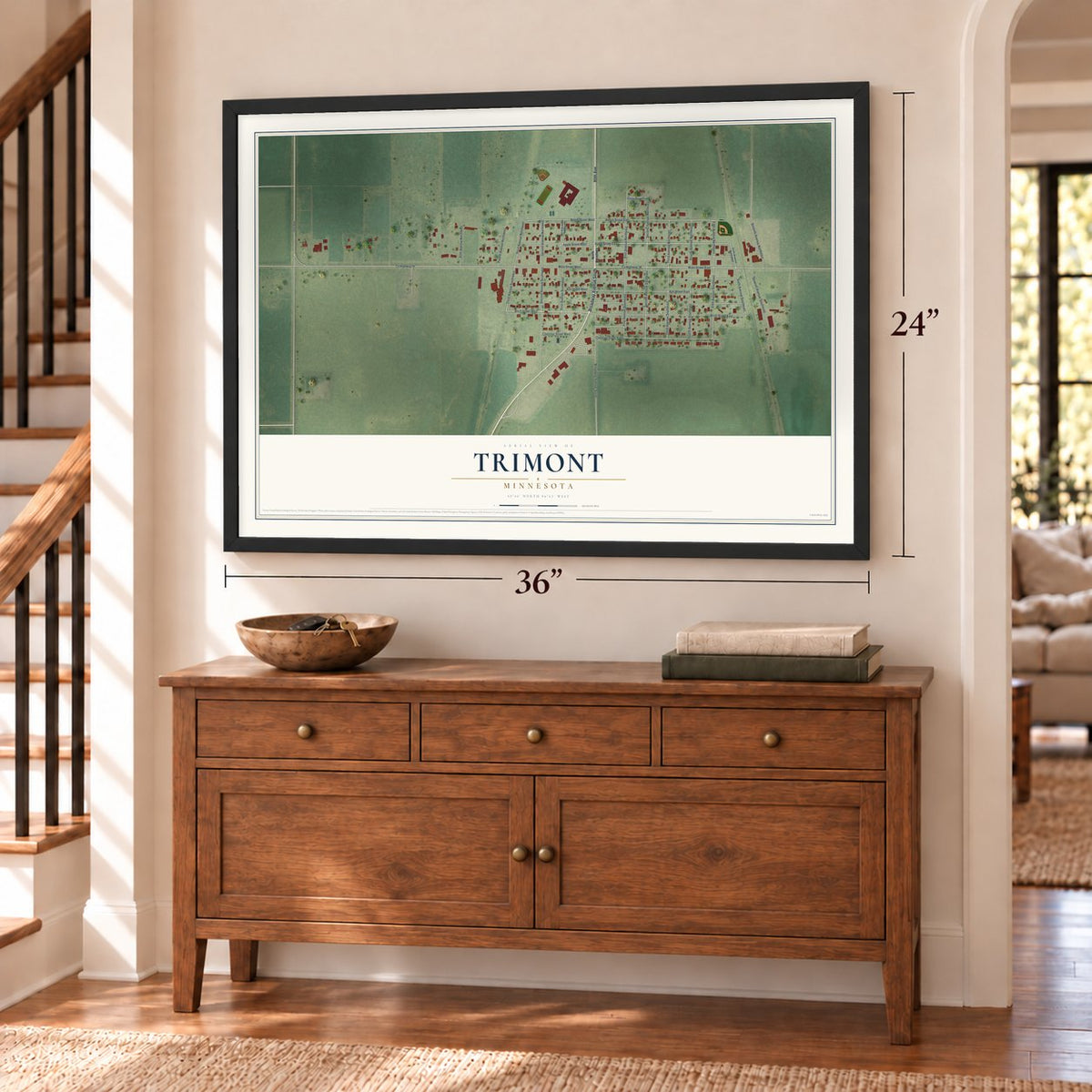 Trimont, Minnesota map, 24 x 36 inch print in a black frame above a dresser by a staircase