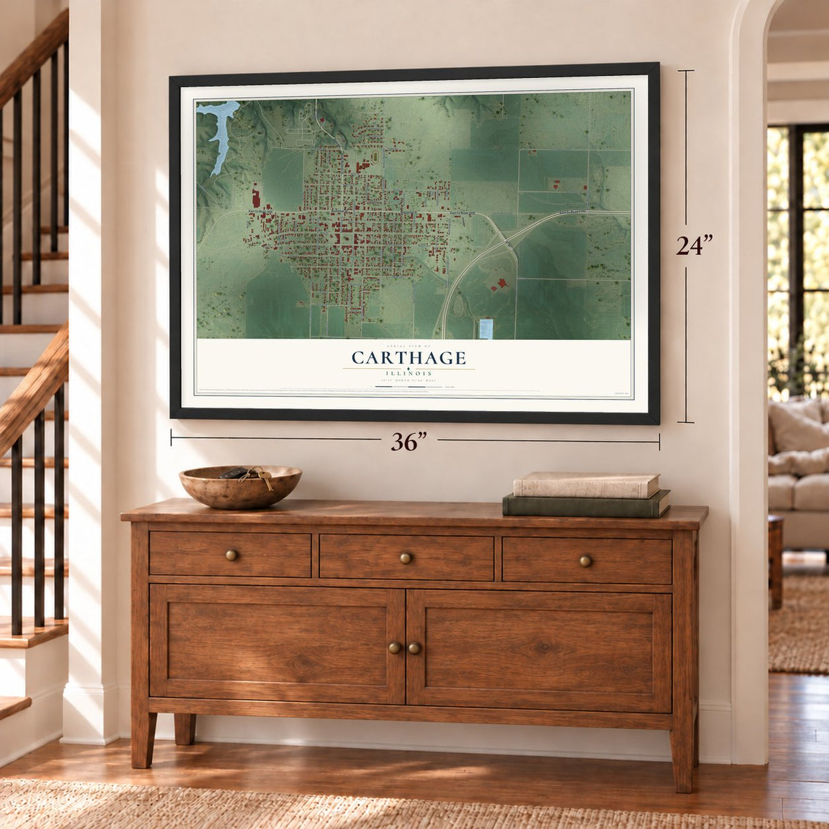 Carthage, Illinois map, 24 x 36 inch print in a black frame above a dresser by a staircase