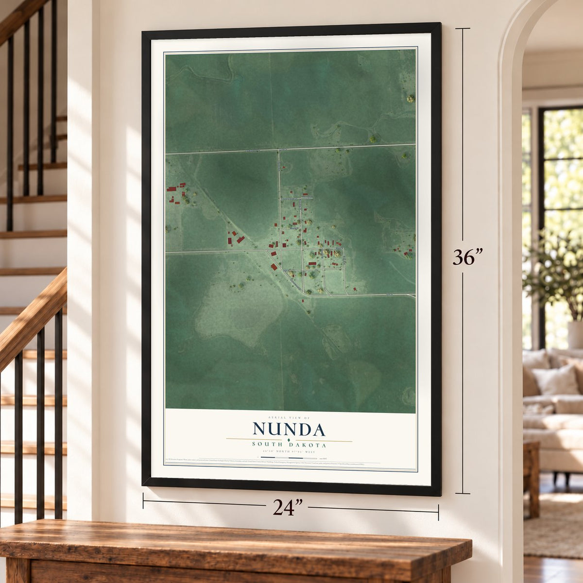 Nunda, South Dakota map, 24 x 36 inch print in a black frame by a staircase