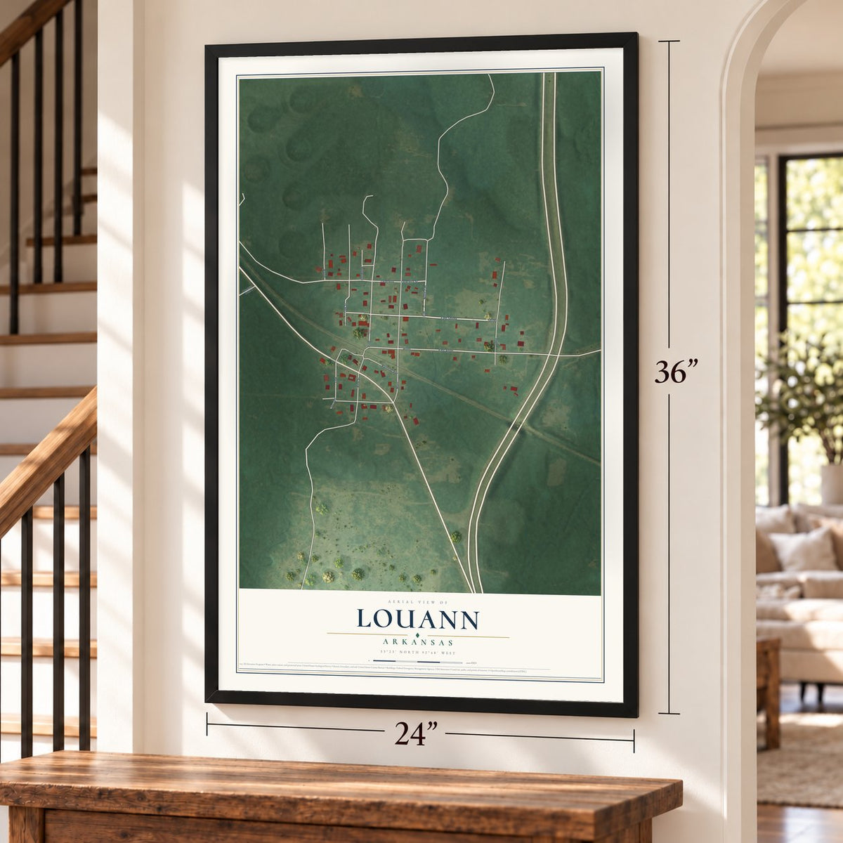 Louann, Arkansas map, 24 x 36 inch print in a black frame by a staircase