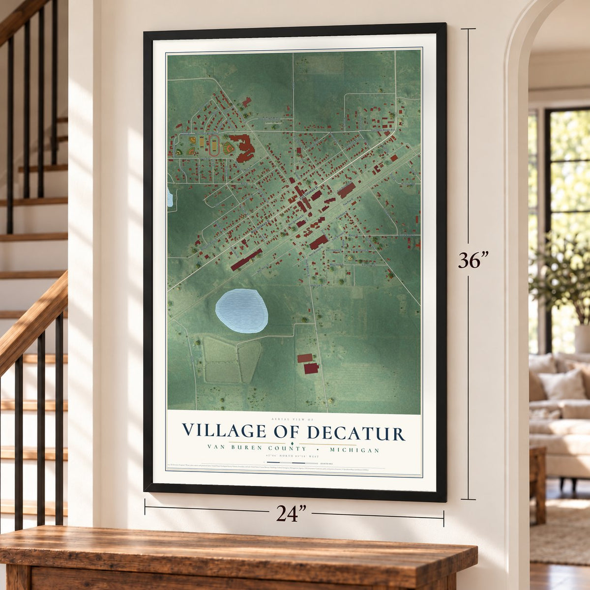 Decatur, Michigan map, 24 x 36 inch print in a black frame by a staircase