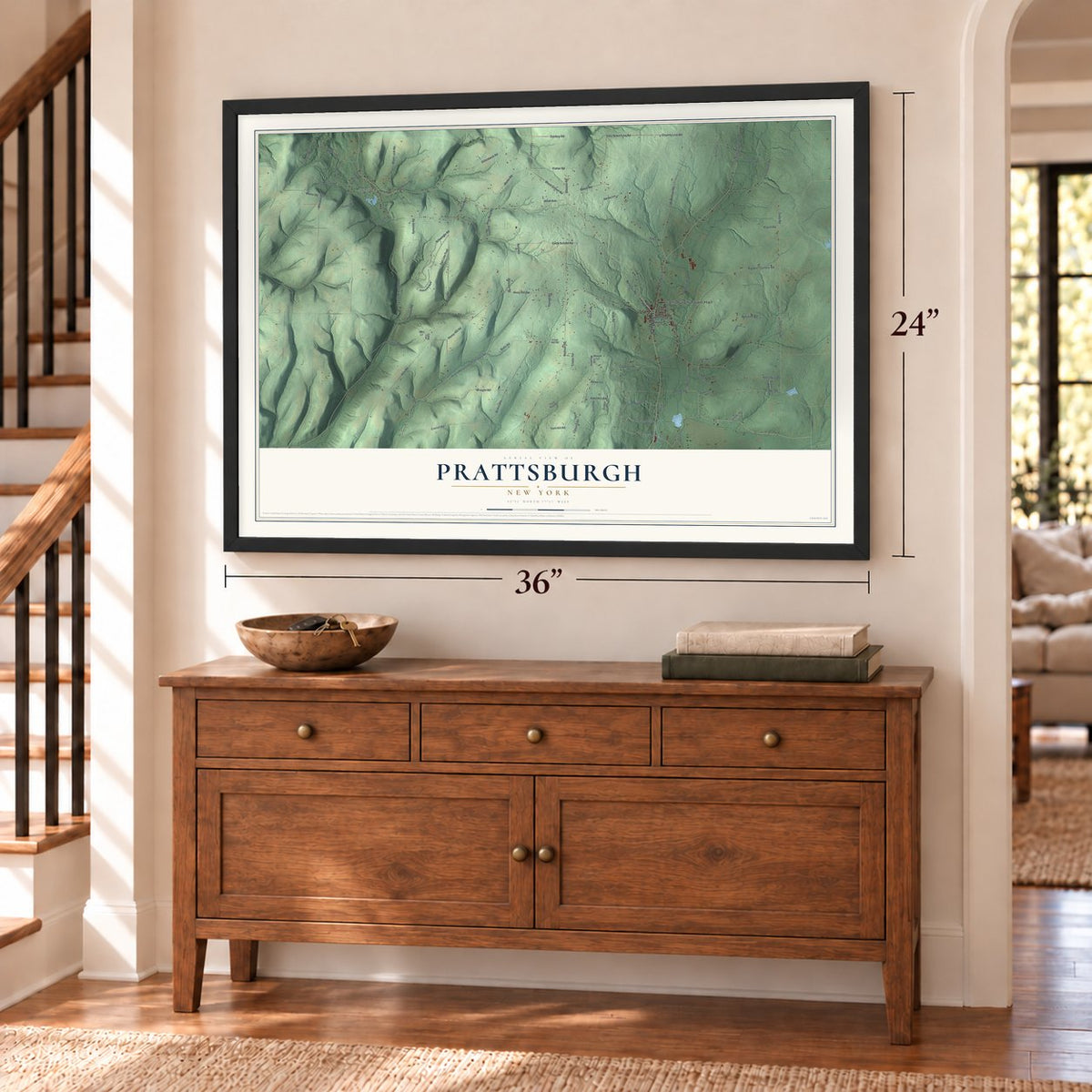 Prattsburgh, New York map, 24 x 36 inch print in a black frame above a dresser by a staircase