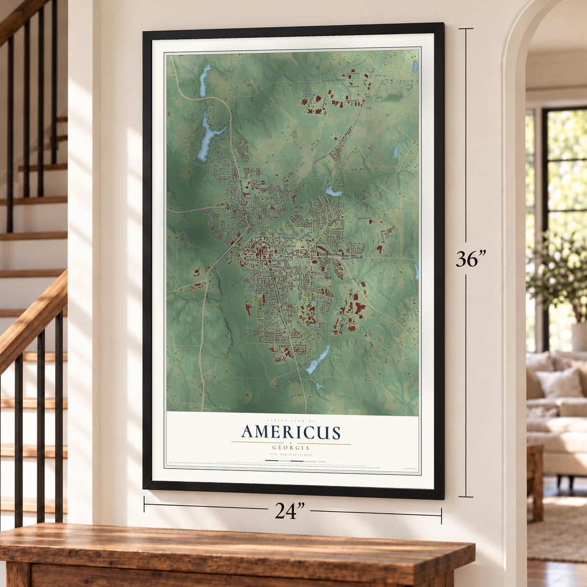 Americus, Georgia map, 24 x 36 inch print in a black frame by a staircase