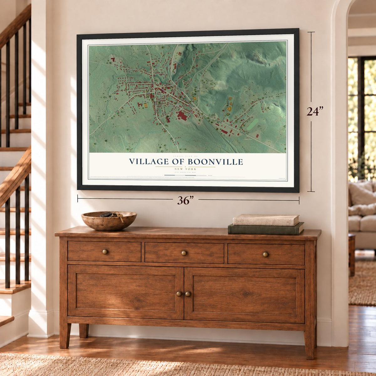 Village of Boonville, New York map, 24 x 36 inch print in a black frame above a dresser by a staircase