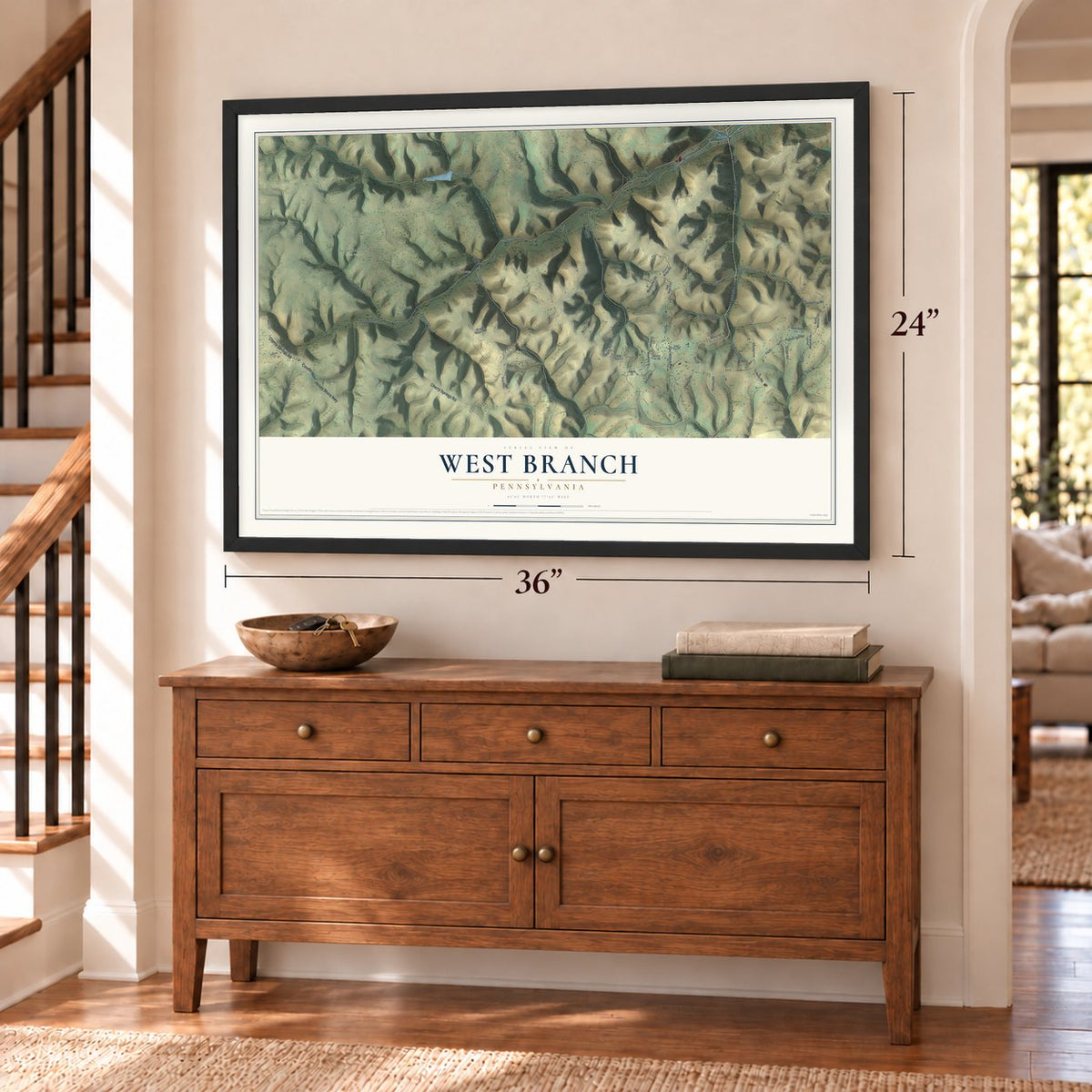 West Branch, Pennsylvania map, 24 x 36 inch print in a black frame above a dresser by a staircase