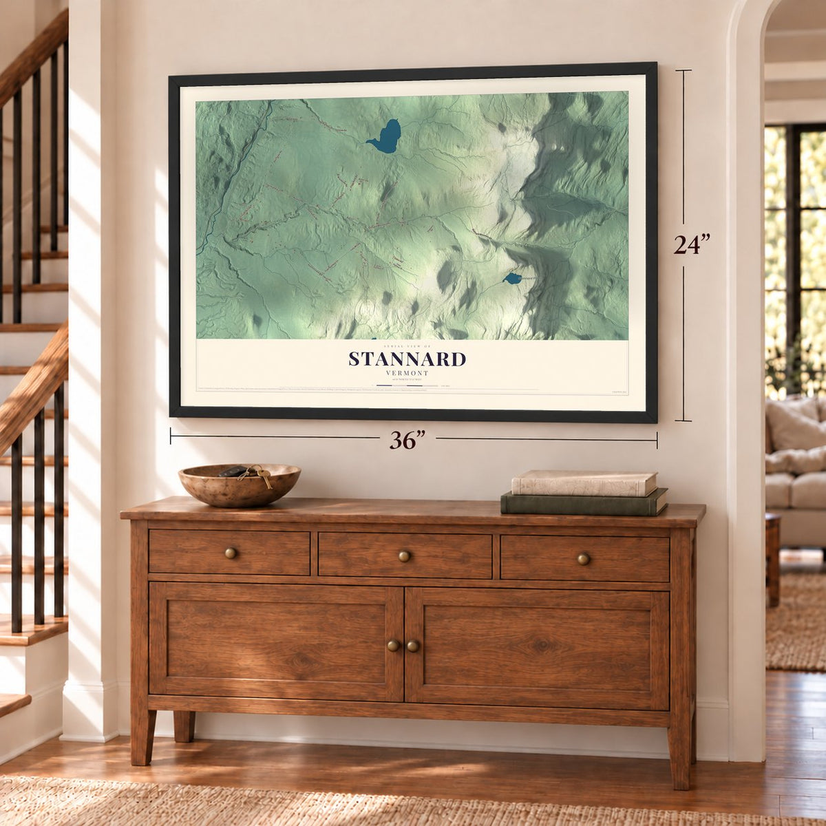 Stannard, Vermont map, 24 x 36 inch print in a black frame above a dresser by a staircase