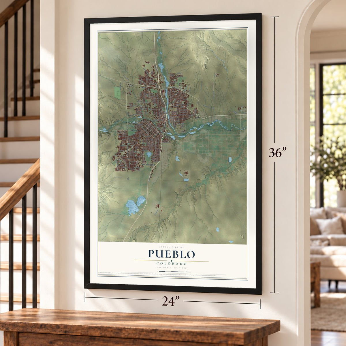 Pueblo, Colorado map, 24 x 36 inch print in a black frame by a staircase